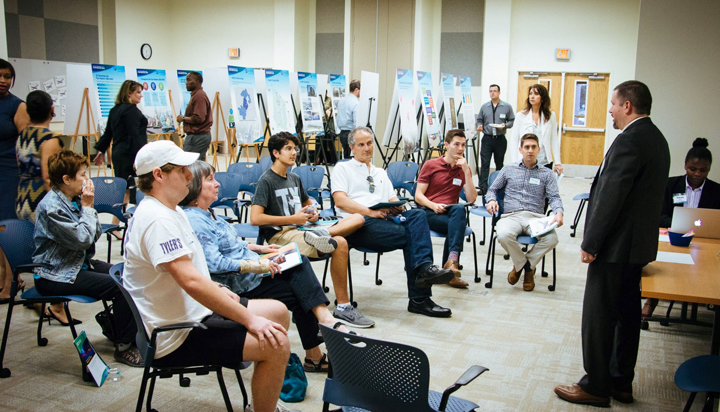 Stations were set up around the room at the first ABIA 2040 Master Plan public workshop to share details on specific topics. - ABIA 2040 Master Plan Project Team