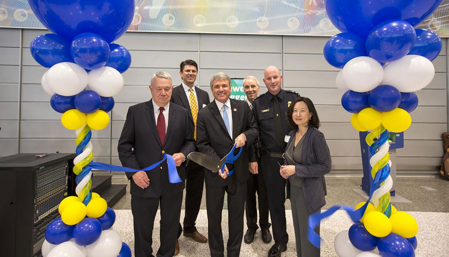 Page Senior Principal, Larry Speck (third from right), participates in the ribbon cutting ceremony. - Talmadge Smith