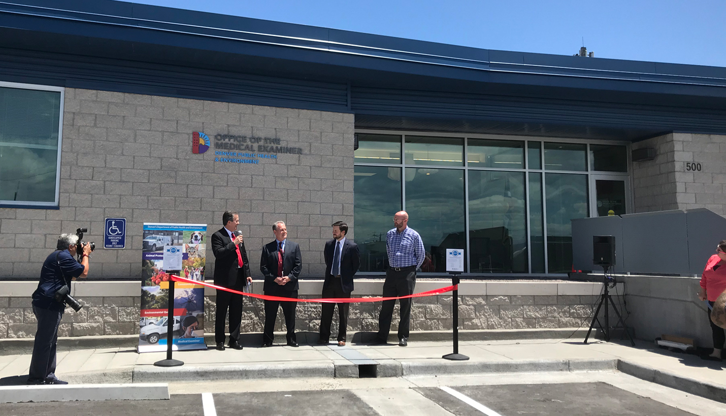 City and county officials from Denver prepare to cut the ribbon on the new Office of the Medical Examiner. - Page