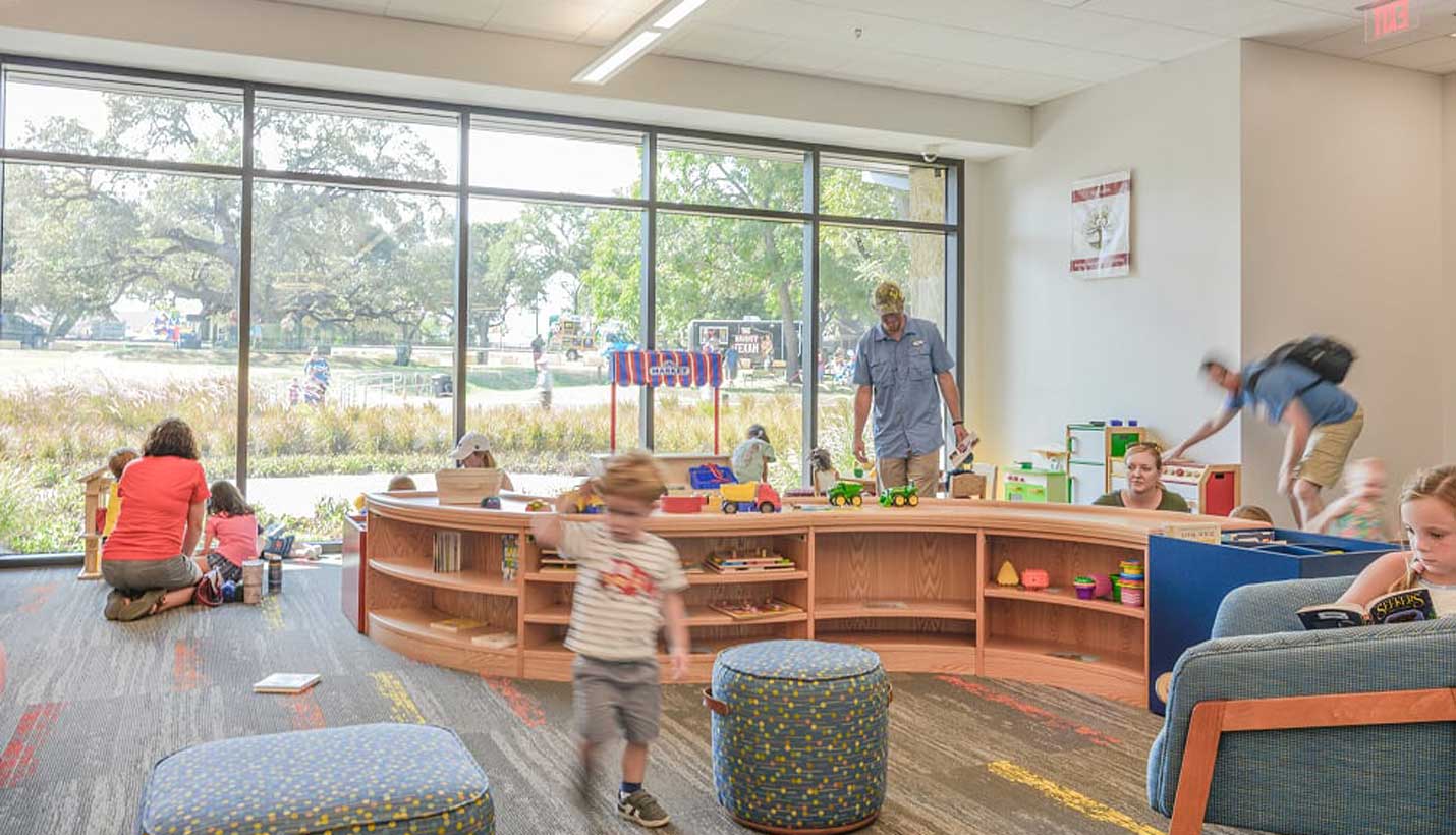 The library, which has been full since it opened, features a variety of spaces for children and teens. - 