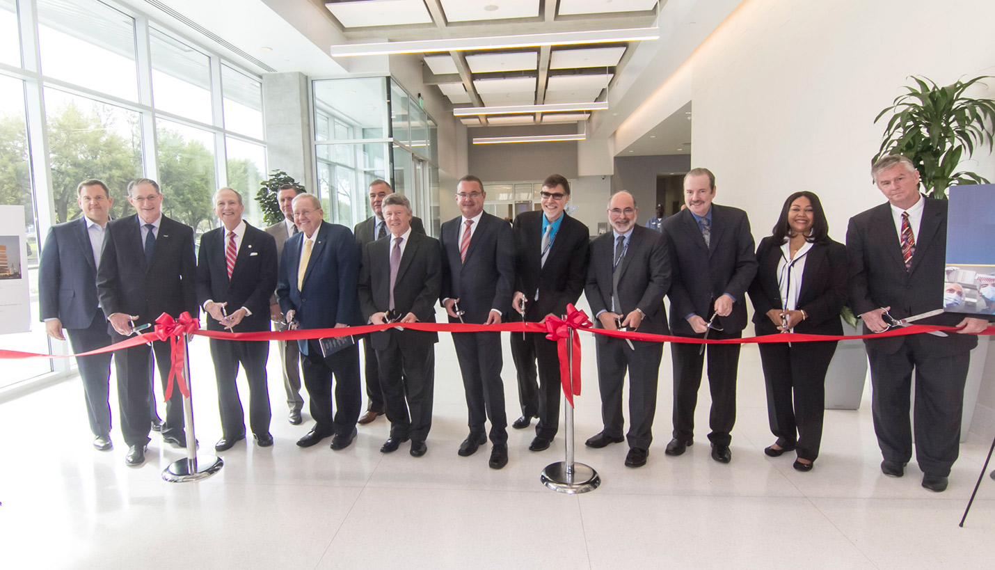 VIP attendees prepare to cut the ribbon to formally open the new Harris County Institute of Forensic Sciences. Page Principal In Charge Jeffrey Bricker is second from the left. - Harris County