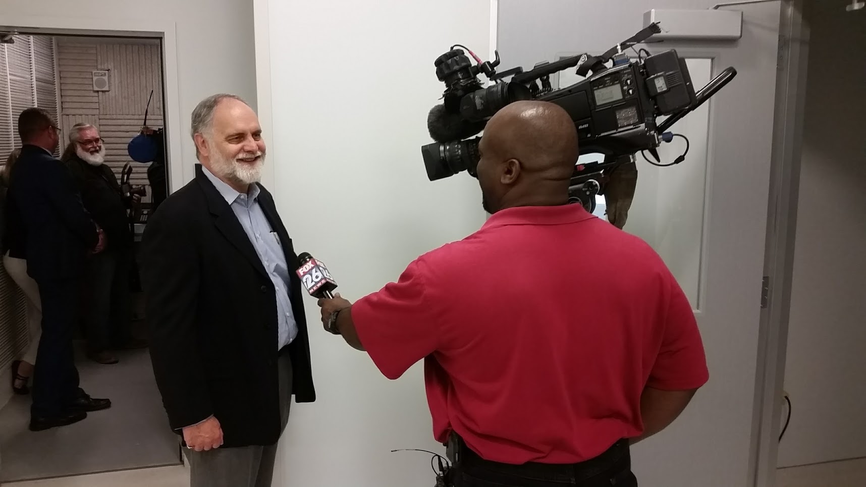 Page Project Manager Rob Owens talks with a reporter during a media tour of the new Harris County Institute of Forensic Sciences. - Page