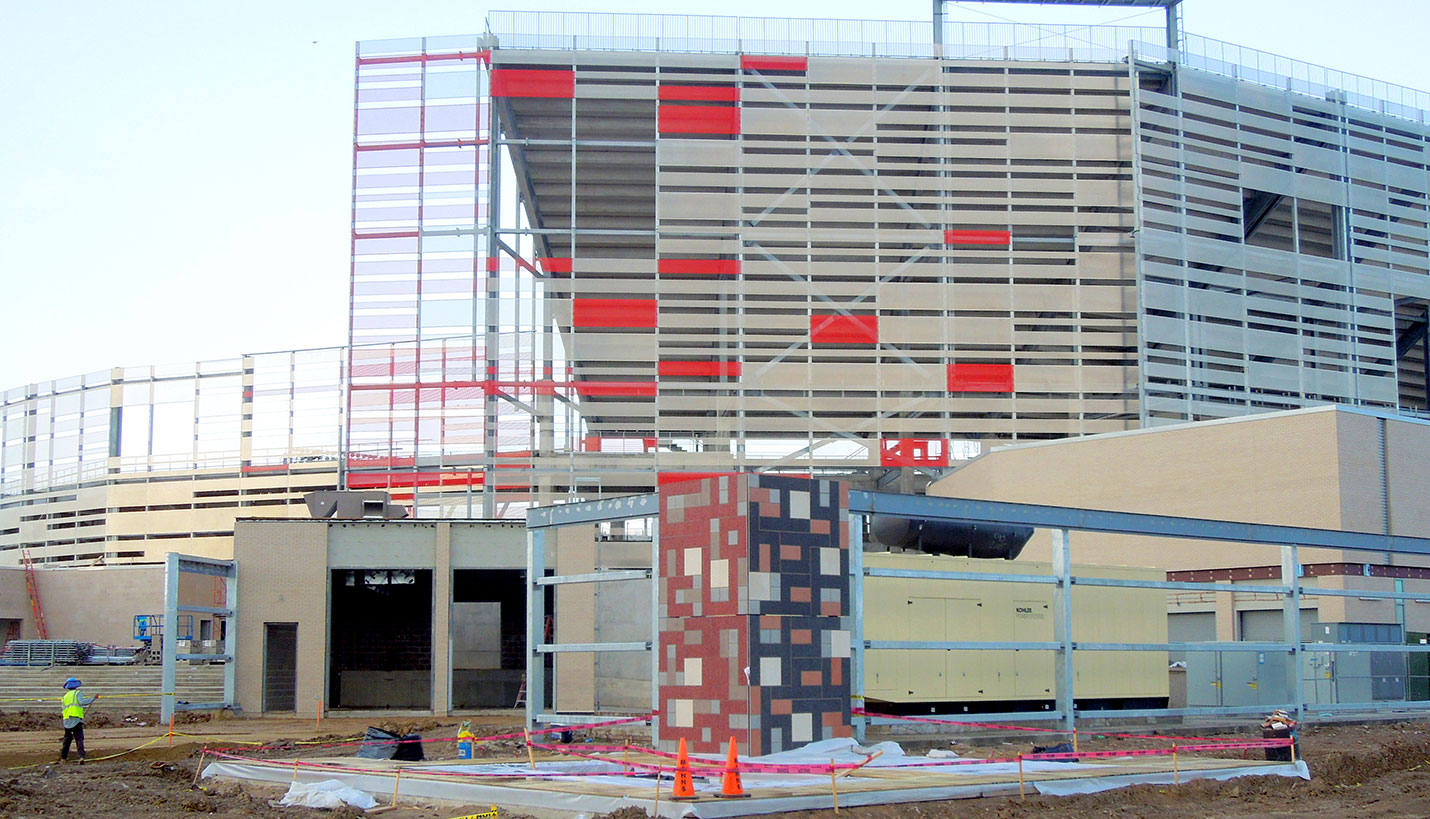 The Art of a Football Stadium Design: Distance shot of public artwork by artist Jim Isermann being installed at the new UH TDECU football stadium. (07/18/2014) - Page