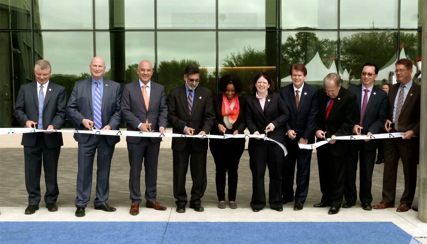 The University of Texas at Arlington President Vistasp Karbhari, fourth from left, was joined by state legislators, administrators, faculty and a graduate student. - The University of Texas at Arlington